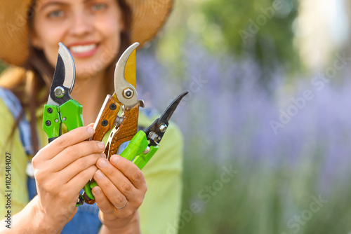 Young female gardener with ...
