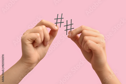 Female hands holding hashta...
