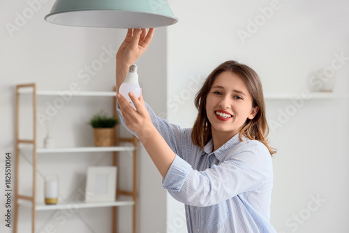 Pretty young woman changing...
