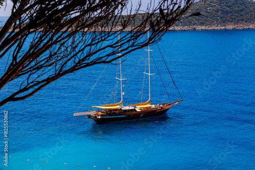 Fototapeta Naklejka Na Ścianę i Meble -  A view of a pleasure sailing yacht moored in the small harbor of Kaputas Beach, Turkey