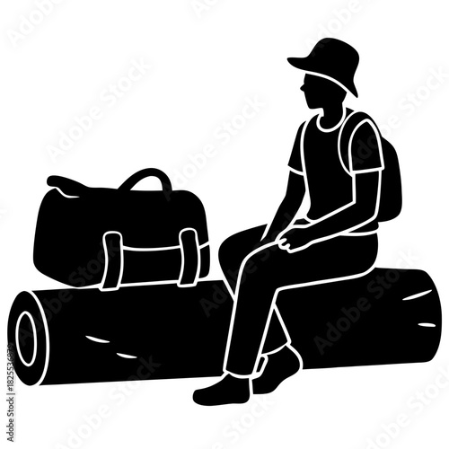Silhouette of a hiker sitting on a log with a backpack and duffel bag