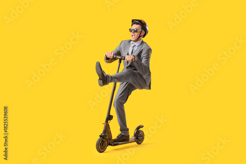 Funny young businessman rid...