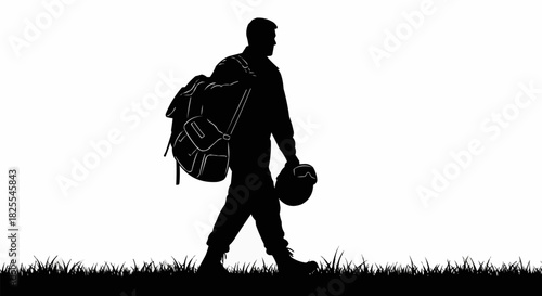 Silhouette of a soldier walking with a backpack and helmet.