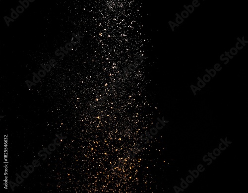 黒い背景に細かい粒子の光が舞っている背景