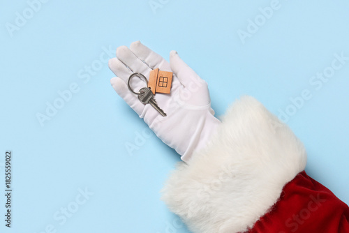 Santa Claus hand with key a...