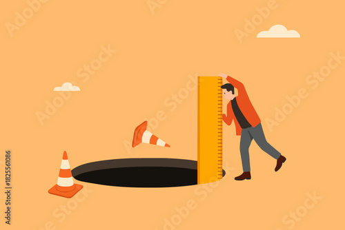 risk estimation, estimate business risk, businessman using a ruler measures the depth of a hole on the road