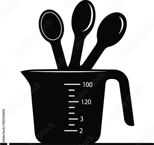 Black measuring cup with three spoons for cooking and baking needs