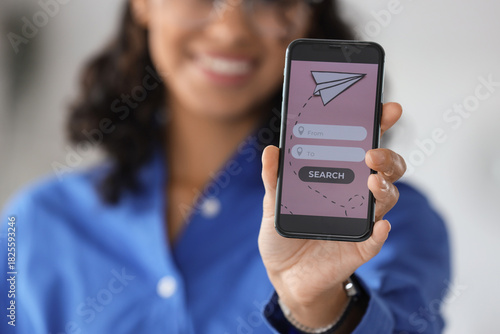 Young businesswoman using m...