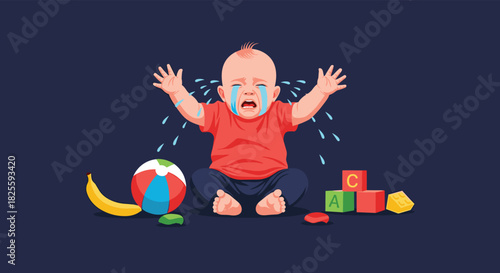 A baby with a red shirt and blue pants sits on the floor, crying with tears, surrounded by a ball, banana, and building blocks.