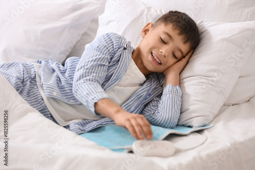 Little boy lying on electri...