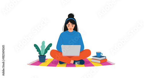 A focused woman engages in remote work or online learning, seated cross-legged on a vibrant rug with a laptop, plant, and books.