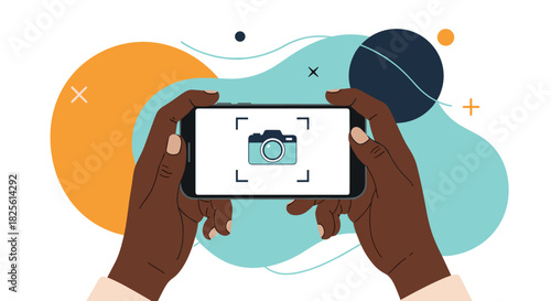 Dark-skinned hands holding a smartphone horizontally, displaying a camera app interface with a focus frame, against an abstract background.