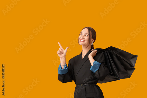 Happy young woman with shop...