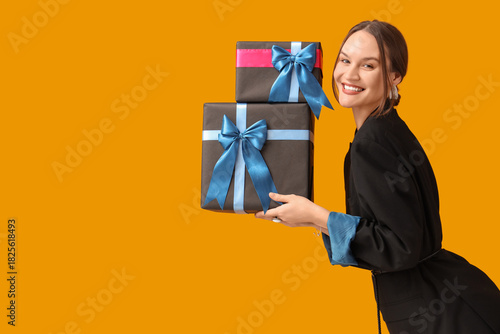 Happy young woman with gift...