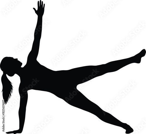 Silhouette of an active woman performing a yoga pose