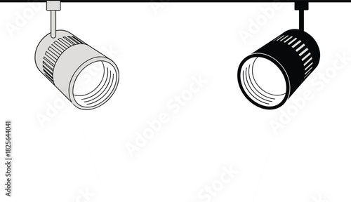 Two spotlight fixtures, one gray and one black, casting light beams Keywords: spotlight, light
