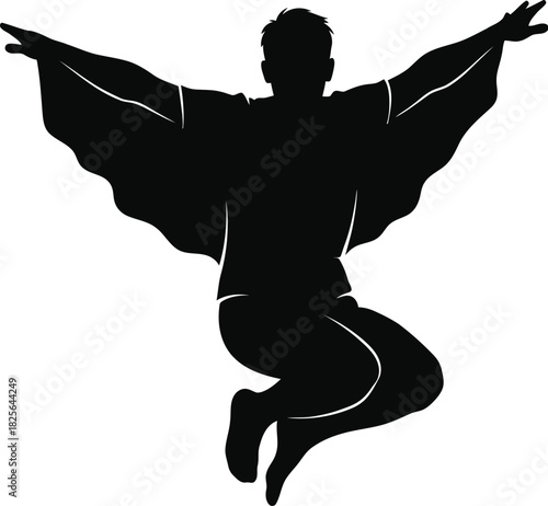 Silhouette of a man jumping with a cape flowing behind