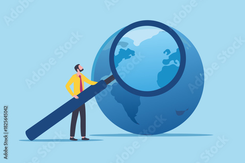 Global analysis man examining the world with magnifying glass
