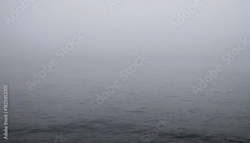 Vast Ocean Surface Blanketed by Serene Haze, Where the Mysterious Horizon Blurs Seamlessly into a Misty Sky, Evoking Calm and Tranquility