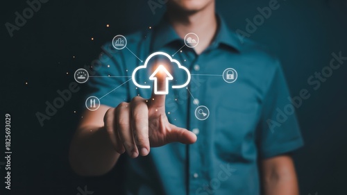 Businessman interacts with a glowing digital interface representing cloud storage upload functionality