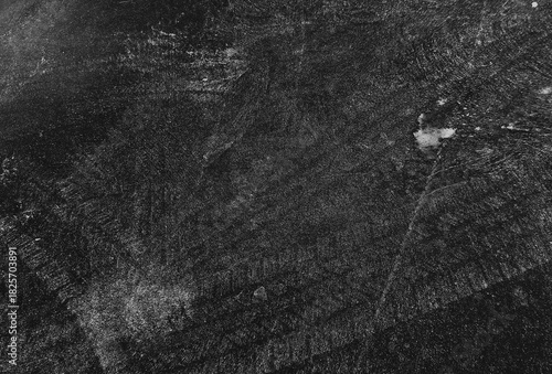 Close up black tire marks on cement floor.