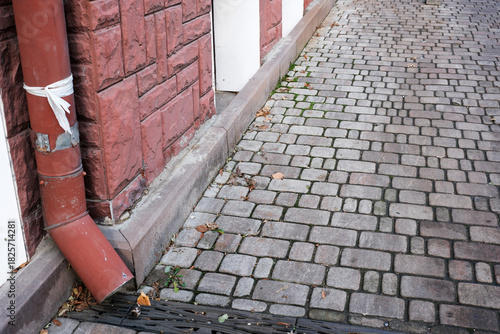 Cobblestone path leading to a charming building in the city