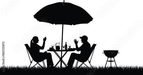 Silhouette of two people enjoying outdoor dining under umbrella canopy with drinks, food, and barbecue grill in relaxing summer garden atmosphere