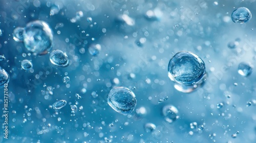 Wallpaper Mural Water droplets float in the air with a bright blue backdrop creating a refreshing atmosphere. This scene captures the beauty of water in motion highlighting nature's elegance. Torontodigital.ca