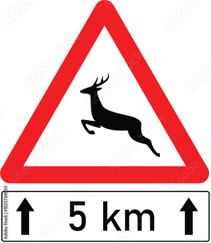 Traffic sign warns about wild animals crossing the road with blue cloudy sky