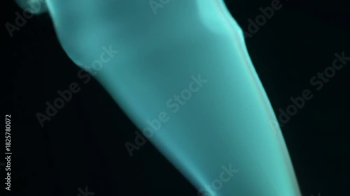 Close-up of a translucent object with ethereal glow against a dark background