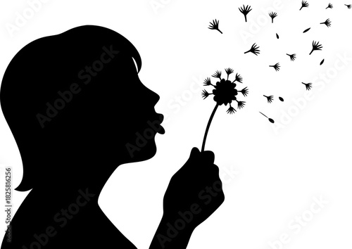Silhouette of a girl blowing a dandelion flower