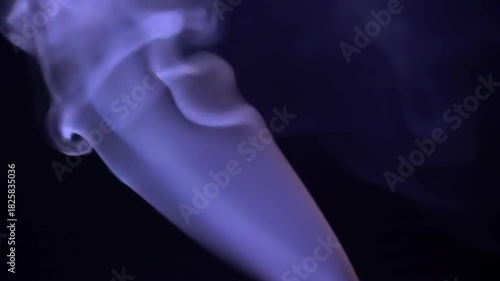 Ethereal smoke swirling gracefully against a dark background, creating a mystical ambiance