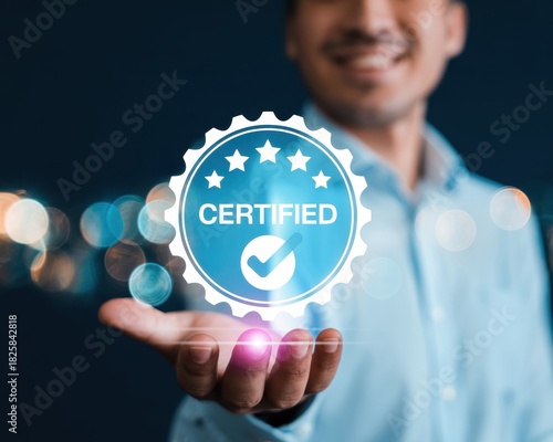 Smiling man holding a glowing blue certified badge, symbolizing quality assurance, trust, and business excellence in a modern setting