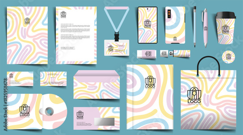 Colorful branding mockup features stationery a shopping bag phone and USB drive all decorated with a pastel wave pattern