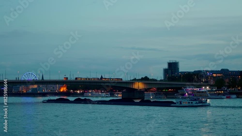 Wallpaper Mural Rhine river bridge with illuminated tram at dusk in Cologne, Germany. Torontodigital.ca