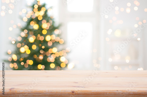 Empty table for product display montage in front of blurred Christmas tree lights background