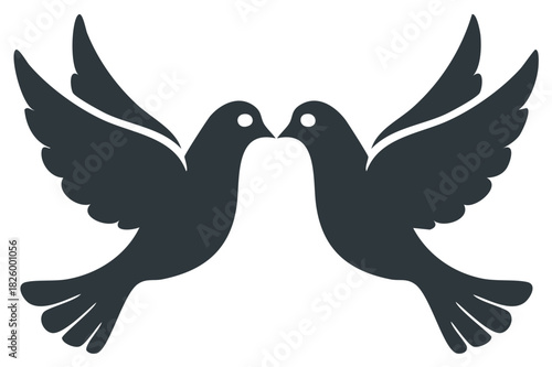 Elegant black silhouette of two doves flying wings spread a symbol of love peace and marriage