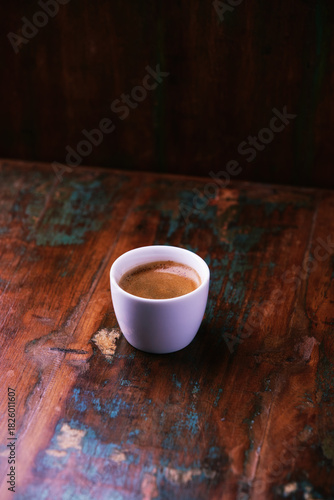 Cup of coffee on rustic wooden background. Soft focus. Copy space	