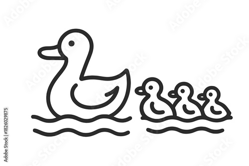 Mother duck swimming with three small ducklings following on the water