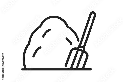 Pitchfork next to a large mound of agricultural or gardening material