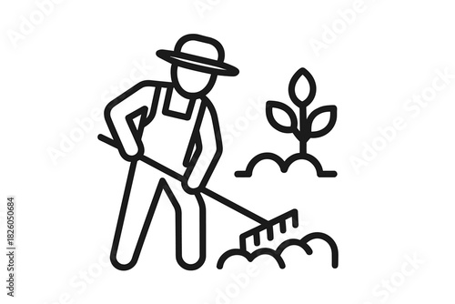 Professional gardener working in the garden using a rake near a growing seedling