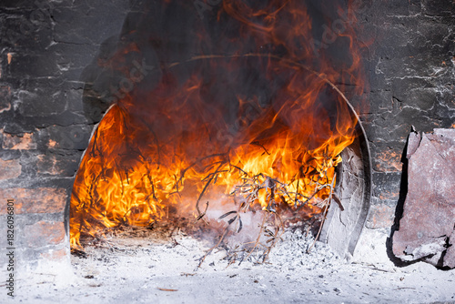 Burning Wood Inside Traditional Stone Oven