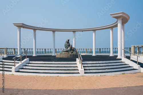Monument to Steller sea lions in Nevelsk city, Sakhalin. Sculpture of northern sea lions on the waterfront. Symbol of the city and popular tourist attraction in Sakhalin region, Russia