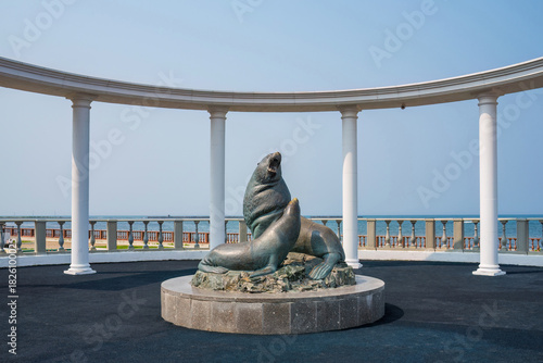 Steller sea lions sculpture on the embankment of Nevelsk, Sakhalin Island. Northern sea lions are the official symbol of the city. Landmark and monument in the Russian Far East