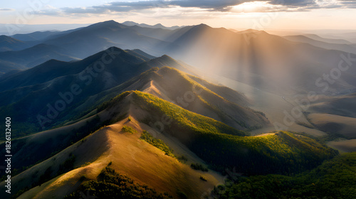 Majestic Mountain Vista: A breathtaking panoramic view of rugged mountains under a radiant sky, evoking a sense of awe and the grandeur of nature's artistry.