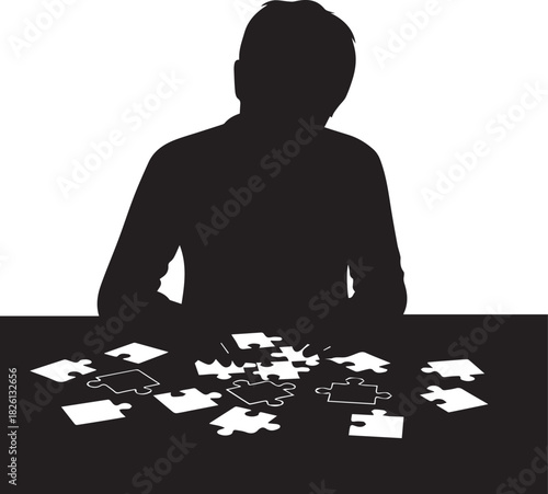 Silhouette of a person intently working on a jigsaw puzzle on a table