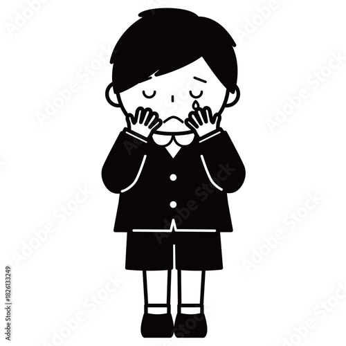 顔を覆って泣いている男の子