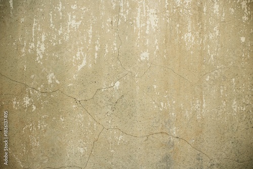 close up of  a cracked white yellowish concrete wall