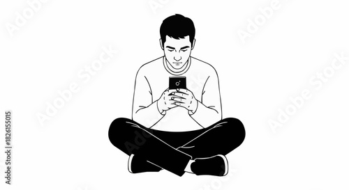 Man engrossed in his phone, sitting cross legged, focused and attentive.