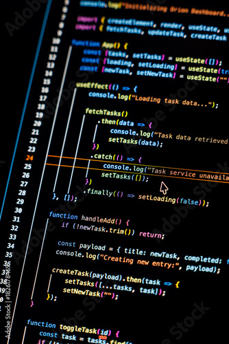 Real-time generated written computer source code in closeup shot on monitor - white letters running on black background - concept of digitization, science, research and course of a program script